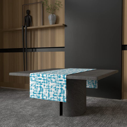 Izzy Velvet Table Runner in Turquoise & Blue, a 35x140 cm plush decorative centerpiece with a chic and refreshing modern design, offers a soft feel with a crisp, coastal aesthetic